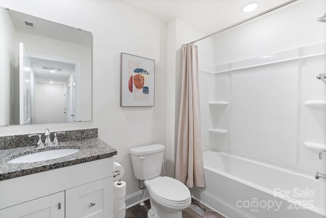 7308 Rothmore St, Charlotte, NC 28215 - full bath featuring toilet, shower / tub combo with curtain, vanity, baseboards, and wood finished floors