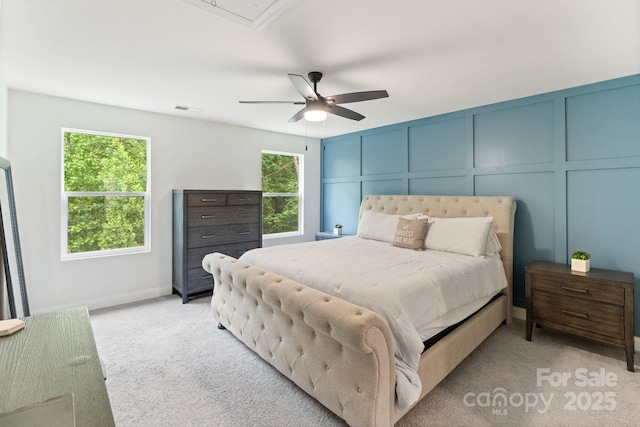 7308 Rothmore St, Charlotte, NC 28215 - bedroom with a decorative wall, light colored carpet, a ceiling fan, and attic access