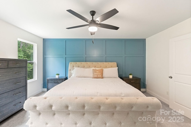 7308 Rothmore St, Charlotte, NC 28215 - bedroom with a decorative wall, baseboards, and a ceiling fan