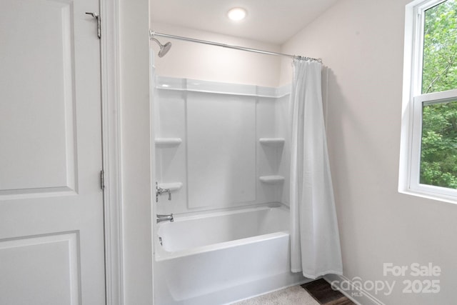 7308 Rothmore St, Charlotte, NC 28215 - bathroom with shower / bath combo with shower curtain and baseboards