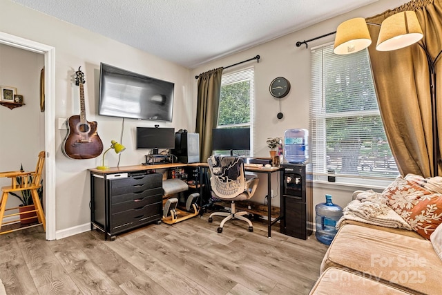office featuring wood finished floors and a textured ceiling