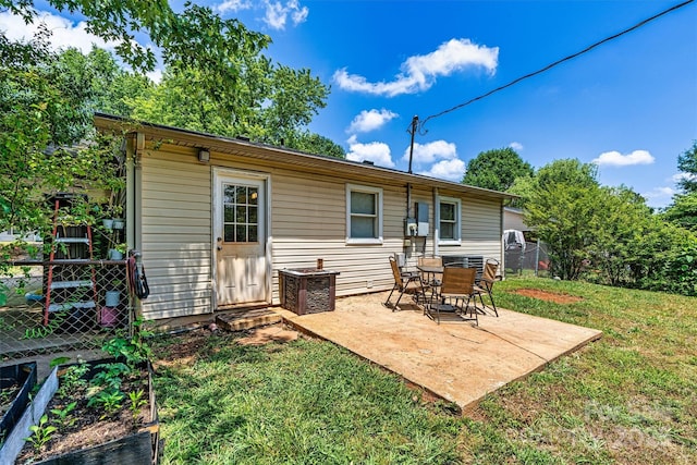 back of property featuring a patio