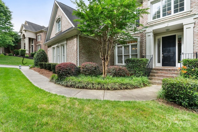 9433 Wallace Pond Dr, Huntersville, NC 28078 - view of home's exterior with brick siding and a lawn