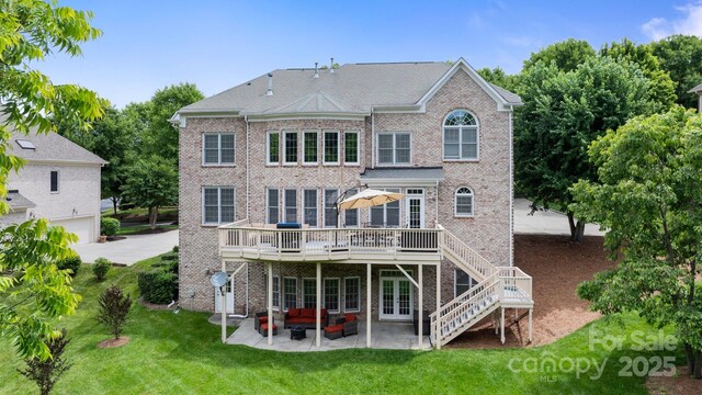 9433 Wallace Pond Dr, Huntersville, NC 28078 - back of house featuring french doors, an outdoor hangout area, brick siding, a lawn, and a deck