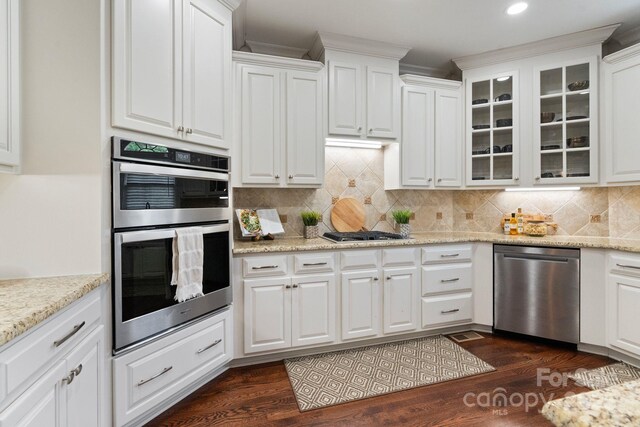 9433 Wallace Pond Dr, Huntersville, NC 28078 - kitchen with appliances with stainless steel finishes, white cabinets, glass insert cabinets, and recessed lighting