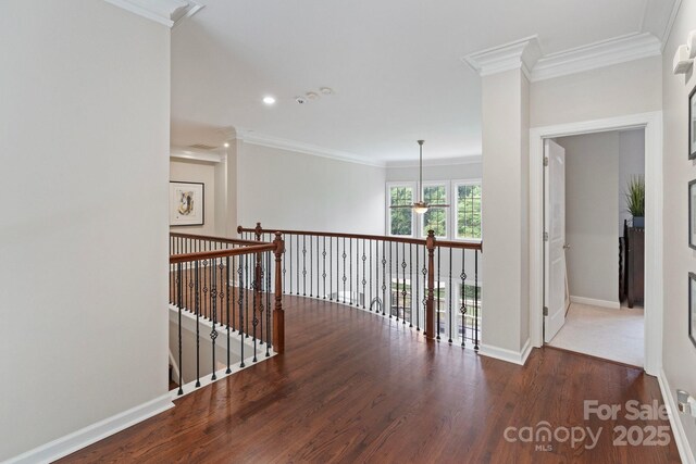 9433 Wallace Pond Dr, Huntersville, NC 28078 - hall featuring wood finished floors, ornamental molding, baseboards, an upstairs landing, and recessed lighting