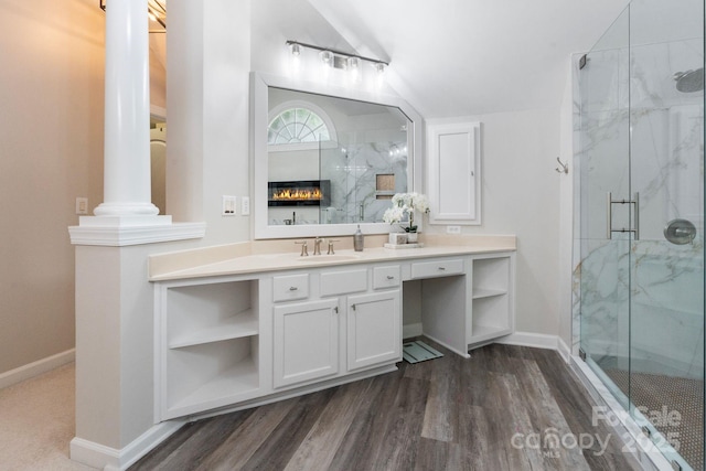 9433 Wallace Pond Dr, Huntersville, NC 28078 - bathroom featuring a marble finish shower, baseboards, vanity, wood finished floors, and lofted ceiling