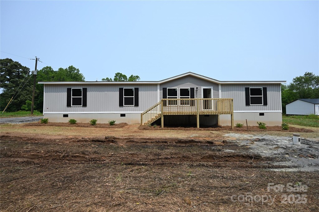 1213 Renno Rd, Clinton, SC 29235 - back of property featuring crawl space and a deck