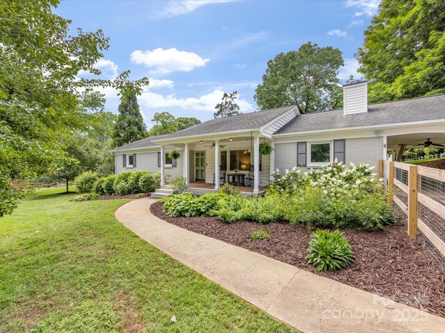 1031 Eldorado Ave, Charlotte, NC 28262 - single story home featuring ceiling fan, a front lawn, a chimney, and a shingled roof