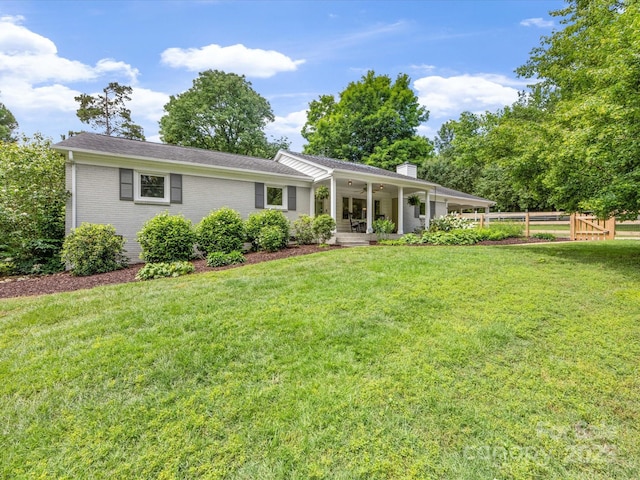 1031 Eldorado Ave, Charlotte, NC 28262 - rear view of property with a chimney, brick siding, and a ceiling fan