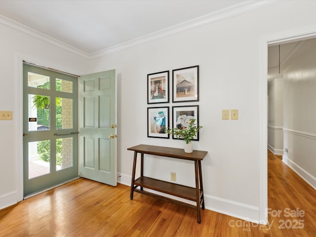 1031 Eldorado Ave, Charlotte, NC 28262 - doorway with ornamental molding, light wood finished floors, and baseboards