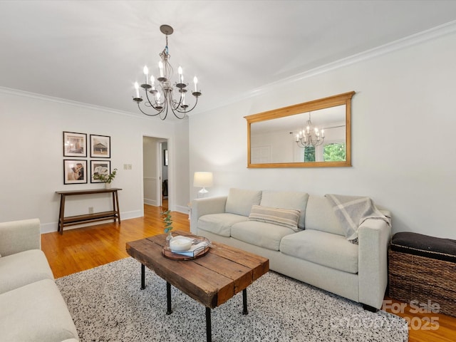 1031 Eldorado Ave, Charlotte, NC 28262 - living area with a chandelier, ornamental molding, wood finished floors, and baseboards