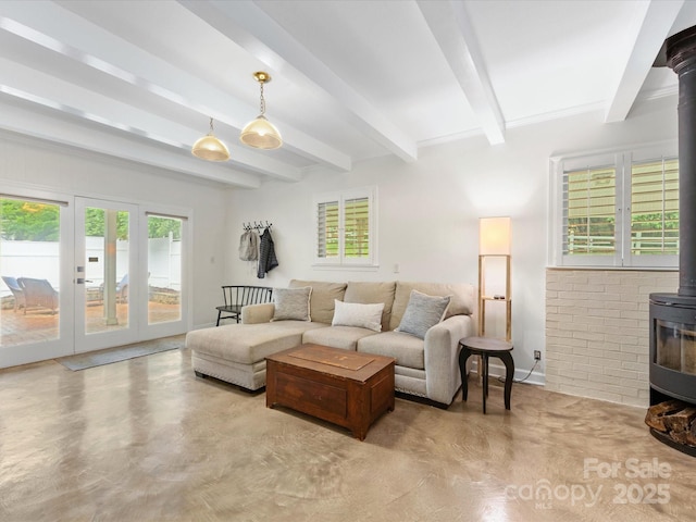 1031 Eldorado Ave, Charlotte, NC 28262 - living area with a wood stove, beam ceiling, and finished concrete floors