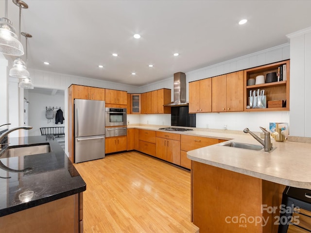 1031 Eldorado Ave, Charlotte, NC 28262 - kitchen with appliances with stainless steel finishes, wall chimney range hood, a sink, a warming drawer, and ornamental molding