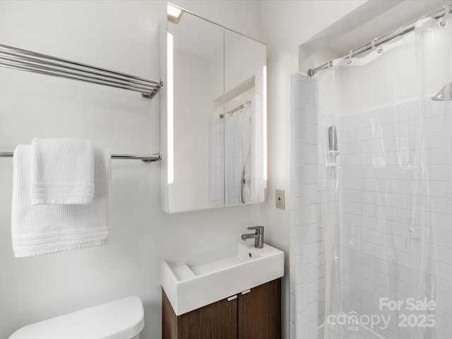 1031 Eldorado Ave, Charlotte, NC 28262 - bathroom featuring toilet, a tile shower, and vanity