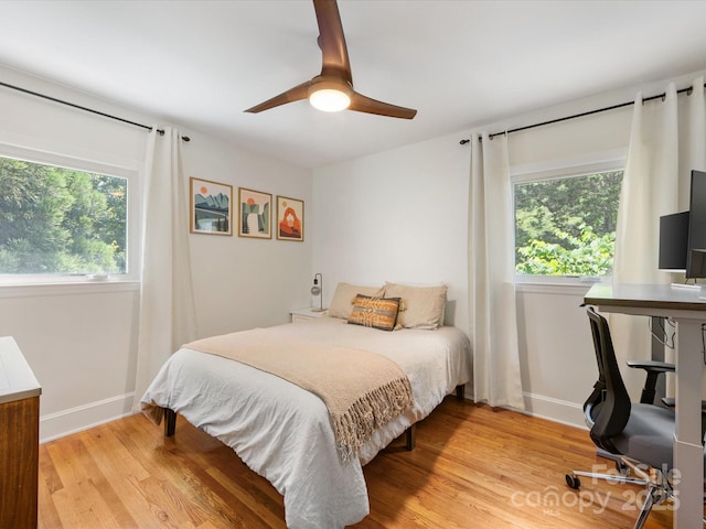1031 Eldorado Ave, Charlotte, NC 28262 - bedroom featuring baseboards, light wood-type flooring, and ceiling fan