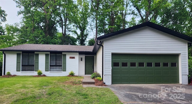 7228 Rollingridge Dr, Charlotte, NC 28211 - single story home featuring a front yard, a garage, driveway, and brick siding