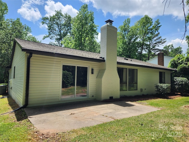 7228 Rollingridge Dr, Charlotte, NC 28211 - back of house with a chimney, a patio area, and a lawn