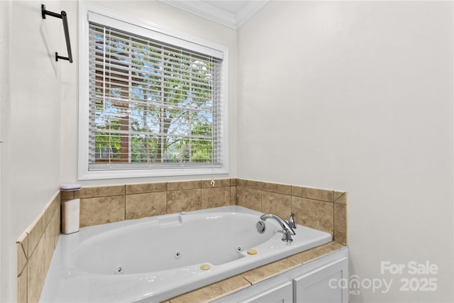 bathroom with ornamental molding and a whirlpool tub
