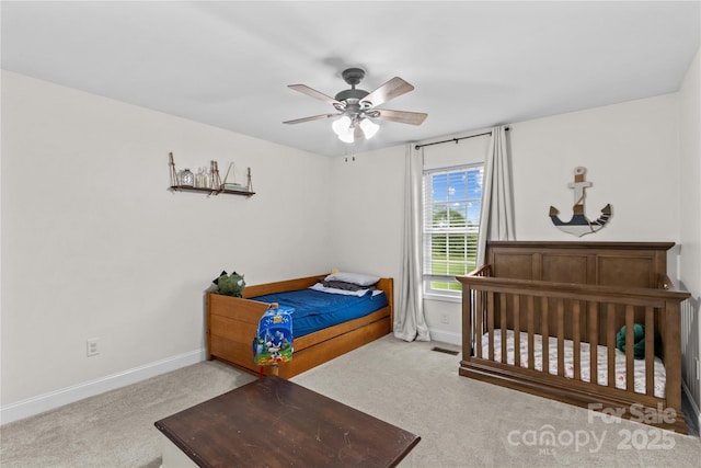 bedroom with carpet, baseboards, and a ceiling fan