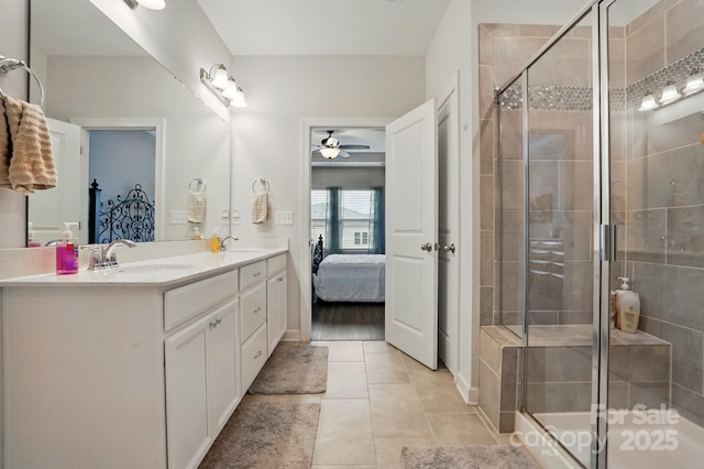 1825 Lotus Ln, Denver, NC 28037 - ensuite bathroom featuring a shower stall, double vanity, a ceiling fan, and tile patterned floors