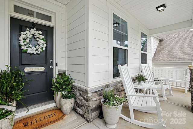 4842 Durneigh Dr, Kannapolis, NC 28081 - doorway to property with covered porch and stone siding