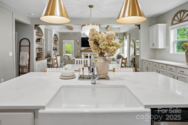 4842 Durneigh Dr, Kannapolis, NC 28081 - kitchen featuring open floor plan, a sink, white cabinetry, light stone countertops, and pendant lighting