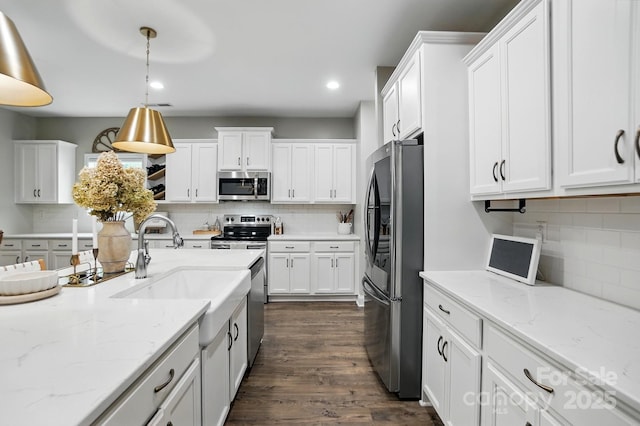4842 Durneigh Dr, Kannapolis, NC 28081 - kitchen with appliances with stainless steel finishes, tasteful backsplash, white cabinetry, and recessed lighting