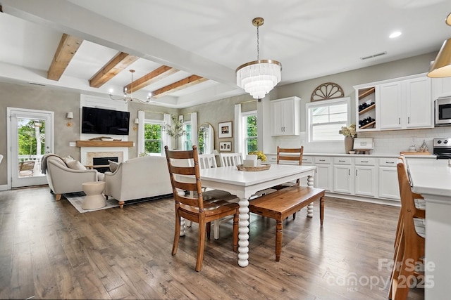 4842 Durneigh Dr, Kannapolis, NC 28081 - dining room with a chandelier, wood finished floors, plenty of natural light, recessed lighting, and beamed ceiling
