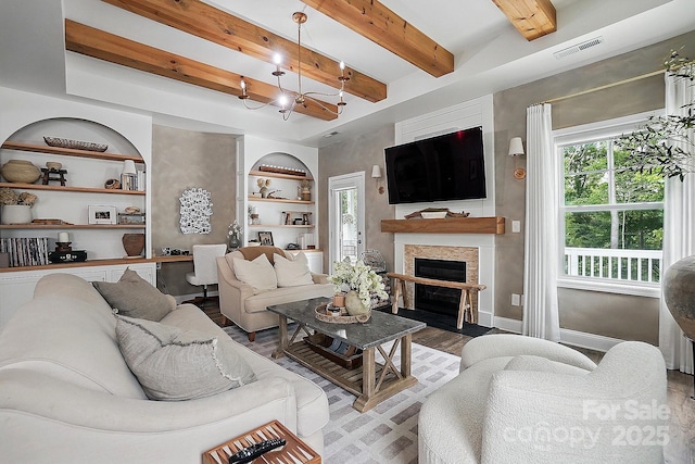 4842 Durneigh Dr, Kannapolis, NC 28081 - living room with baseboards, healthy amount of natural light, beamed ceiling, wood finished floors, and a fireplace