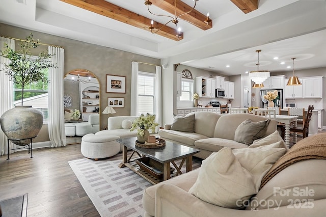 4842 Durneigh Dr, Kannapolis, NC 28081 - living room featuring a chandelier, wood finished floors, recessed lighting, beamed ceiling, and baseboards