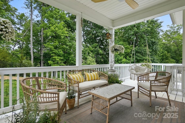 4842 Durneigh Dr, Kannapolis, NC 28081 - sunroom featuring ceiling fan, view of scattered trees, and an outdoor hangout area