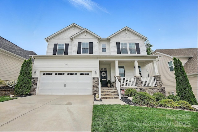 4842 Durneigh Dr, Kannapolis, NC 28081 - craftsman-style home featuring covered porch, a garage, concrete driveway, stone siding, and a front lawn