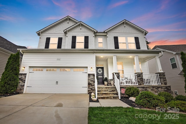 4842 Durneigh Dr, Kannapolis, NC 28081 - craftsman house featuring covered porch, concrete driveway, stone siding, and an attached garage