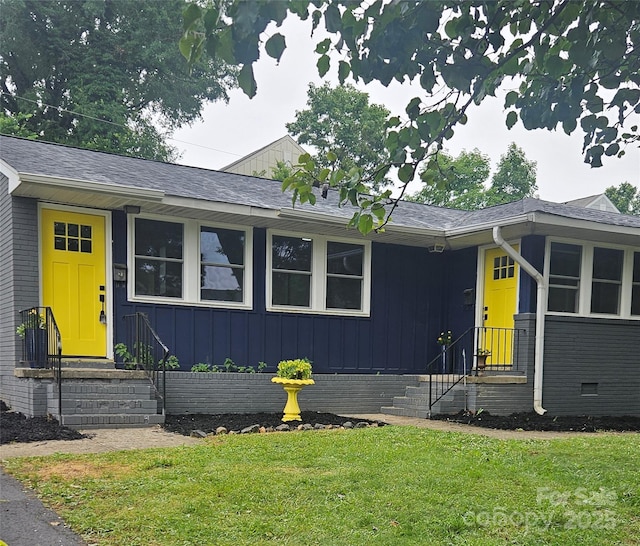 1412 Wembley Dr, Charlotte, NC 28205 - view of front of property with a front lawn, board and batten siding, a shingled roof, and crawl space