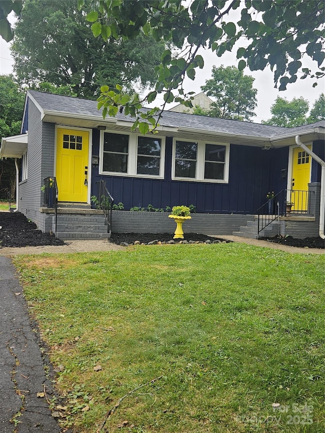 1412 Wembley Dr, Charlotte, NC 28205 - single story home featuring entry steps, a front lawn, and board and batten siding