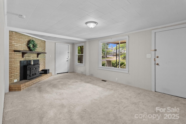 unfurnished living room with carpet flooring and crown molding