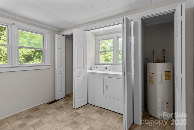 washroom featuring electric water heater, independent washer and dryer, and ornamental molding
