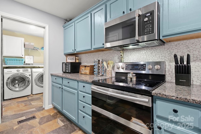 kitchen featuring stainless steel appliances and blue cabinets