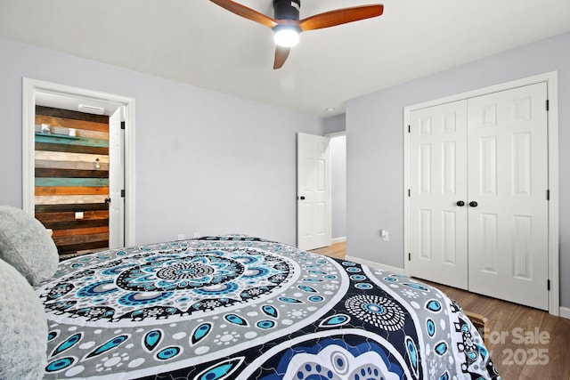 bedroom with light wood-type flooring, a closet, baseboards, and a ceiling fan