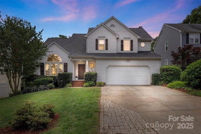 8605 Tamarron Dr, Charlotte, NC 28277 - traditional-style house featuring concrete driveway, an attached garage, a front yard, and a shingled roof