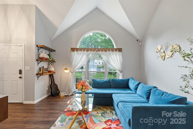 8605 Tamarron Dr, Charlotte, NC 28277 - living area featuring dark wood-style flooring, vaulted ceiling, and baseboards