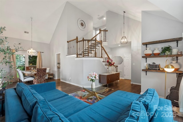8605 Tamarron Dr, Charlotte, NC 28277 - living area featuring high vaulted ceiling, stairs, a chandelier, and wood finished floors