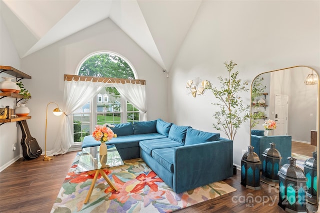 8605 Tamarron Dr, Charlotte, NC 28277 - living room with wood finished floors, baseboards, and high vaulted ceiling