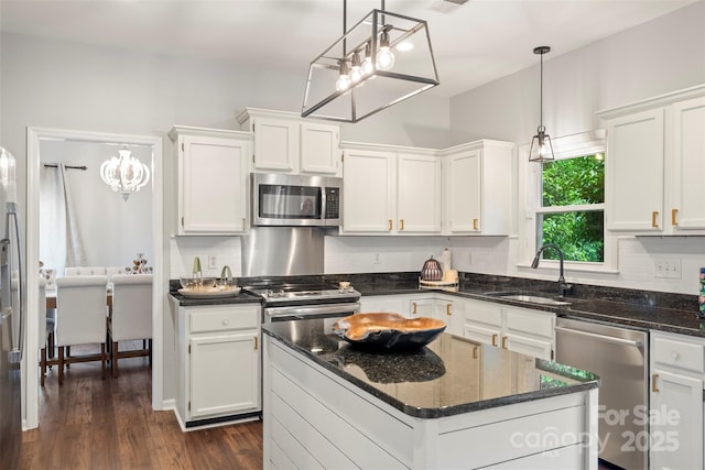 8605 Tamarron Dr, Charlotte, NC 28277 - kitchen with stainless steel appliances, a sink, and white cabinetry