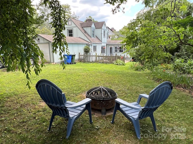 6 Craggy Cir, Asheville, NC 28803 - view of grassy yard featuring a fire pit, an outbuilding, and a garage