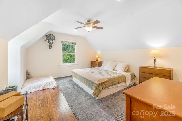 6 Craggy Cir, Asheville, NC 28803 - bedroom with hardwood / wood-style flooring, vaulted ceiling, and a ceiling fan