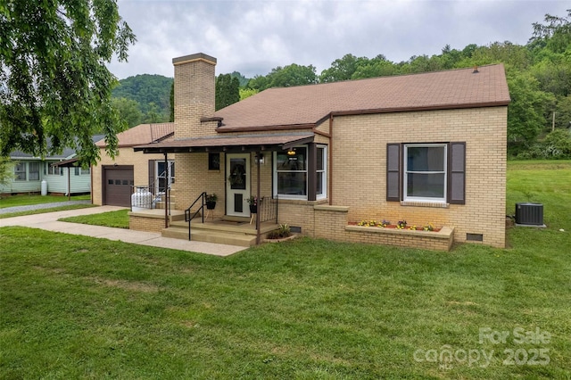 back of property with an attached garage, brick siding, central air condition unit, concrete driveway, and a chimney