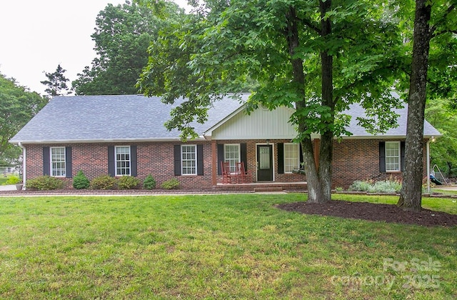 1610 Ford St, Charlotte, NC 28216 - ranch-style house featuring brick siding, a front lawn, and roof with shingles