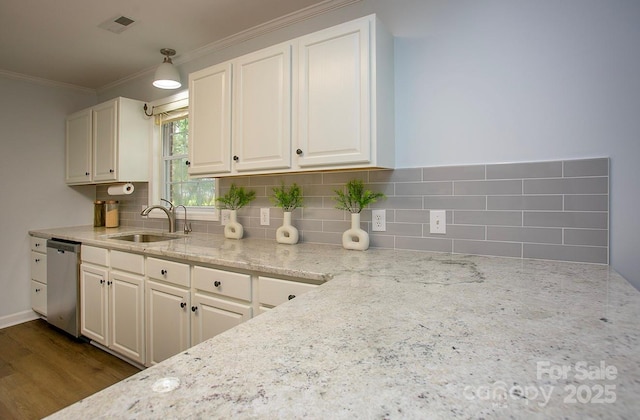 1610 Ford St, Charlotte, NC 28216 - kitchen featuring stainless steel dishwasher, a sink, ornamental molding, decorative backsplash, and light stone countertops